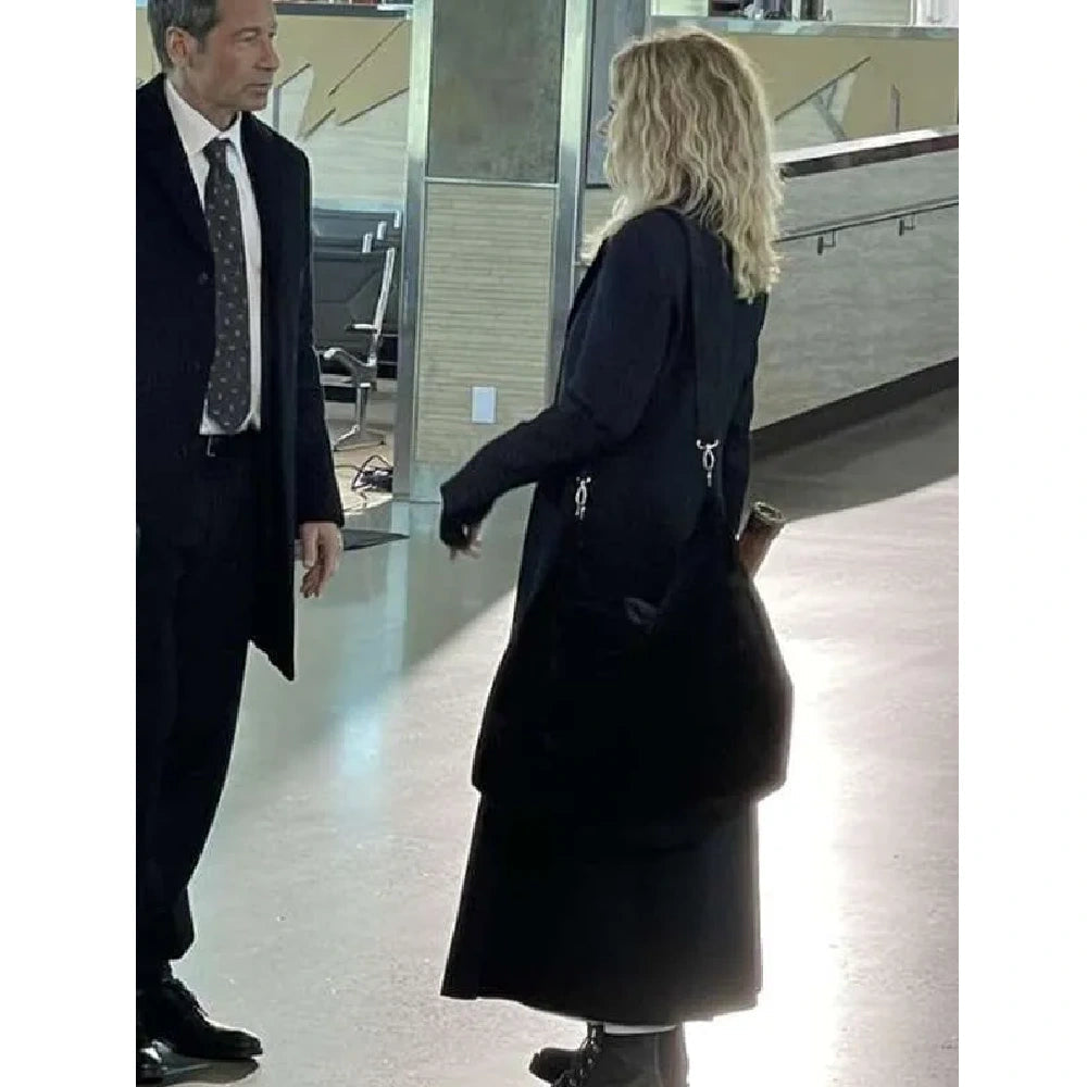 Meg Ryan black trench coat
