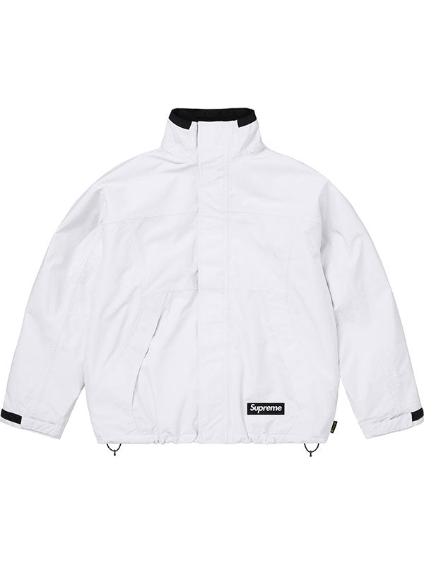 White Supreme Gore-Tex jacket with hood down, front view highlighting the clean colorblock silhouette.